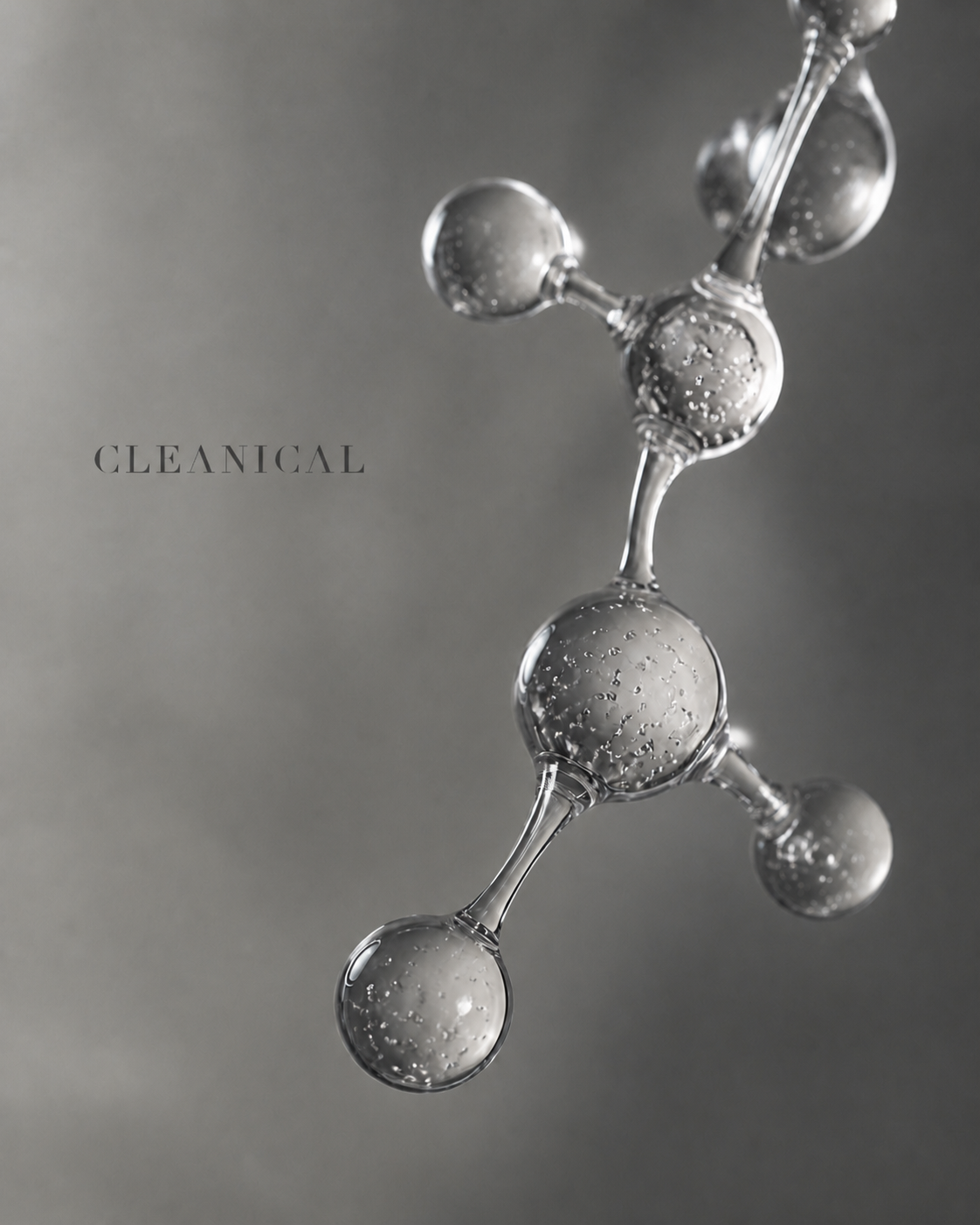 银灰玻璃分子结构与微小 CLEANICAL 标题构成的纯净科研编辑画面