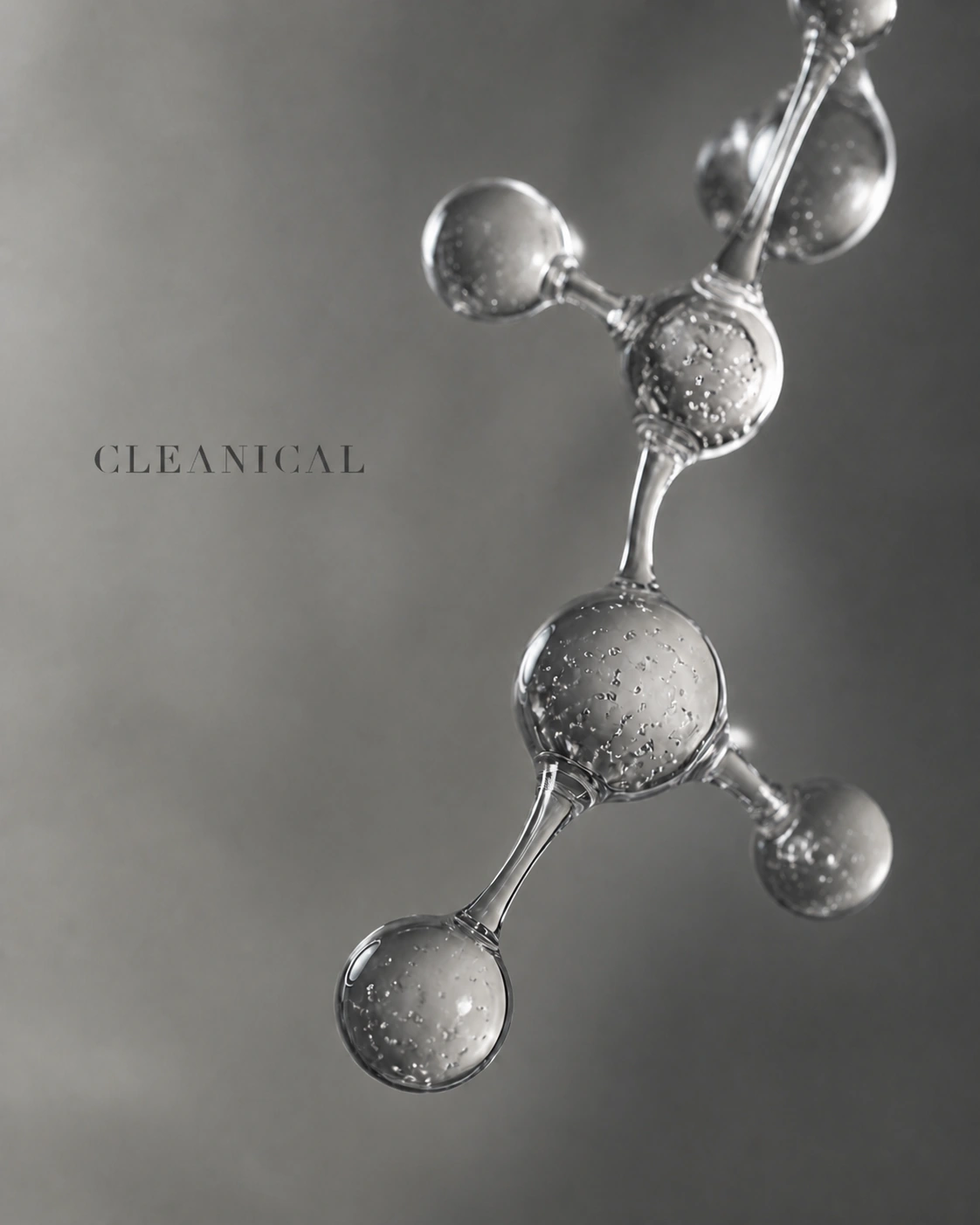 银灰玻璃分子结构与微小 CLEANICAL 标题构成的纯净科研编辑画面